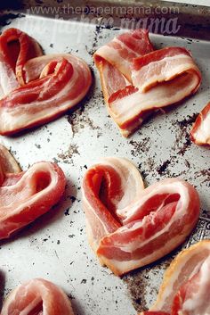 bacon in the shape of hearts on a baking sheet with words that read i feel like bacon love