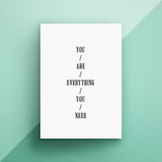 a white poster with the words you are everything you need on it against a green background