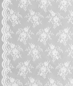 a white lace doily on a gray background