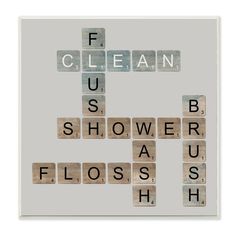 a cross made out of scrabble tiles with the words clean and us shower as flossish