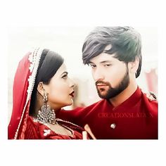 a man and woman dressed in red are looking into each other's eyes with love