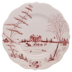 a red and white plate with a winter scene on it