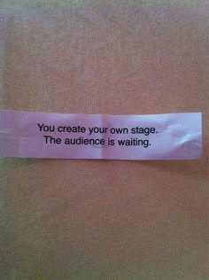 a piece of paper that has some type of message on it with the words you create your own stage