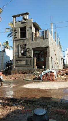 a building under construction with a fire hydrant in the foreground