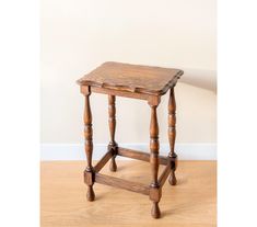 Charming side table with hand carved legs and a scalloped tabletop. The table is constructed from  oak wood. This is a handmade piece from the 1930s.  The table would be a fabulous addition to any home!  There are some moist stains on the tabletop. Inclosing, there is a tiny wood chip on one of the legs, as seen in the last picture. The table is still in a good, vintage condition and is ready to use. The dimensions of the table are 48 (H) x 32.5 (W) x 26 (D) CM // 18.9 (H) x 12.8 (W) x 10.2 (D) INCHES For my customers outside of Europe please contact me prior to purchase of multiple items. I can provide you with a combined shipping quote and I will refund overages if applicable!  Each order will be wrapped carefully and will be sent out with a tracking number and insurance, terms and condi Small Wooden Table, Plant Stool, French Side Table, Colonial Home Decor, English Country Home, Antique Side Table, Oak Side Table, Carved Legs, Vintage Side Table