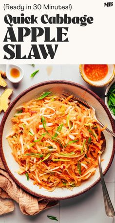 an apple slaw is served in a bowl on a table with other ingredients and utensils