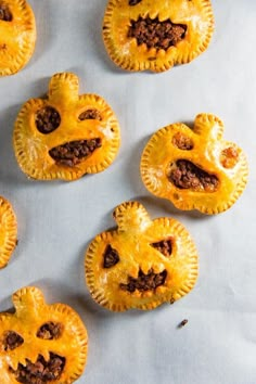 pumpkin pies with jack - o'- lantern faces on them