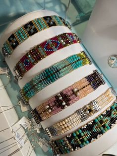 a stack of bracelets sitting on top of a table