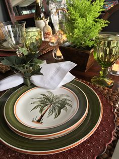 there is a palm tree on the plate and napkins that have been placed on it