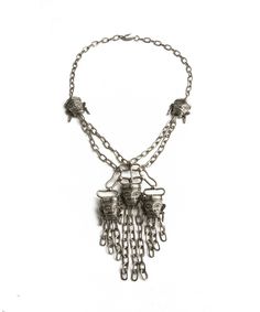 GORGEOUS vintage pendant necklace by Pauline Rader! Circa 1970s - 1980s, this statement piece features a HUGE pendant (over 5" long!) in a silver tone metal. The details on this piece are incredible: five tribal, Aztec faces with engraved and embossed features, each with earrings and chains which dangle kinetically from the bottom of the pendant. The original engraved and textured chain measures a bit over 22" long and closes with an adjustable hook and eye latch. Signed on the reverse. A remark Stowe Vt, Runway Necklace, Silver Mask, Display Mannequins, Vintage Pendant Necklace, Vintage Pendant, Metal Pendant, Statement Jewelry, Vintage 70s