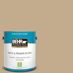 a pink paint can with the words behr premium plus on it's side