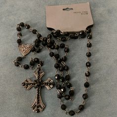 This Is A Lovely Silvertone And Glittering Black Bead Rosary That Was Sold By Target As A Necklace. I'm Going To Restrain Myself From Giving My Speech About Sacramentals And Using A Rosary As A Necklace (And The Theologian And Catholic). A Friend Gave These To Me And They Could Be Used As A Necklace As Target Intended (See The Tag) Or As A Beautiful Rosary To Pray With. A Friend Pass These On To Me And I Would Like To Sell Them In Support Of Our Ministries. Emo Cross Necklace, Cool Cross Necklaces, How To Make A Cross Necklace, Sirius Black Jewelry, Cross Necklace Goth, Grunge Cross Necklace, Cross Necklace Gothic, Mcbling Jewelry, Goth Essentials