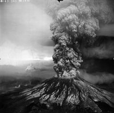 a black and white poster with an image of a volcano