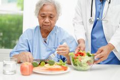 Asian Nutritionist holding healthy food for patient in hospital, nutrition and vitamin stock images In Hospital, Healthy Food, Food Animals, Planting Flowers, Vitamins, Nutrition, Healthy Recipes