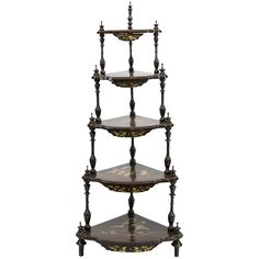 three tiered shelf with ornate designs on it