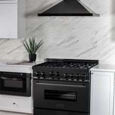 a black stove top oven sitting inside of a kitchen next to a white countertop