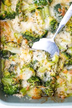 a casserole dish with broccoli and cheese in it, ready to be eaten