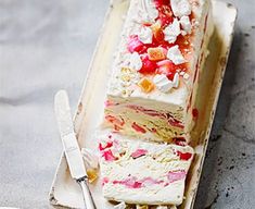 a piece of cake sitting on top of a plate next to a knife and fork