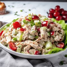 a white bowl filled with salad on top of a table