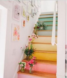 some flowers are sitting on the stairs