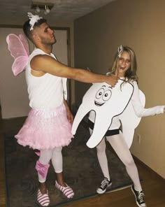 a man and woman dressed up in costumes