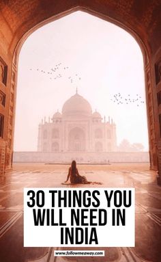 a person sitting on the ground in front of a building with text overlay that reads 30 things you will need in india