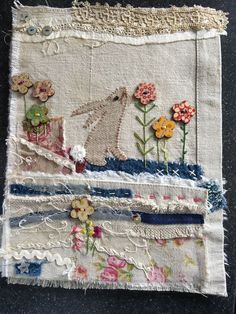 a piece of fabric with flowers on it and some other things in the back ground