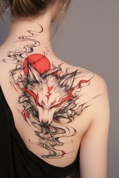 the back of a woman's neck with a wolf tattoo design on her left shoulder