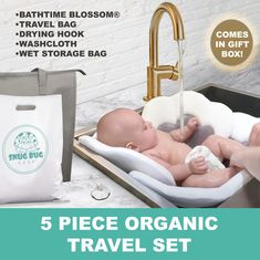 a baby in a bathtub with the words 5 piece organic travel set next to it