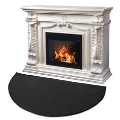 a white fireplace with a black mat on the floor