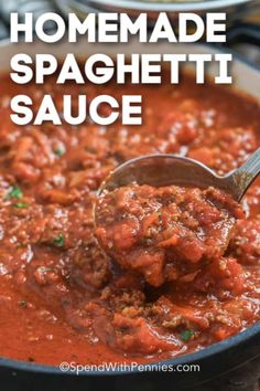 homemade spaghetti sauce in a skillet with a ladle scooping up some food