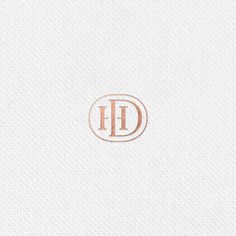 the letter h is inscribed in a circle on a white paper background with an orange outline