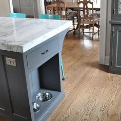 a kitchen island with an open dog door