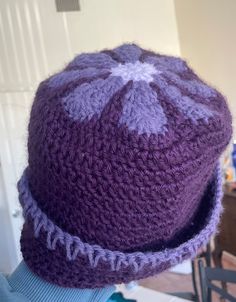 Step into retro vibes with this handmade retro daisy crochet purple hat! Inspired by the bold and bright styles of the 70s, this vibrant hat features a retro-style daisy on top with a funky edge, making it a standout accessory for any outfit. Features: Retro Daisy Design: Crafted with care, each hat is designed with daisy motifs that bring a nostalgic, flower-child flair to your wardrobe. Edge Stitching Detail: The hat's edge is accented with intricate stitching, adding a unique finishing touch that enhances its handmade charm. Soft & Comfortable: Made from soft, durable yarn, this crochet hat is lightweight yet cozy, perfect for year-round wear. Perfect for All Seasons: Whether you're channeling 70s festival vibes, staying warm in the fall, or adding a stylish statement to your spring war Silly Clothes, Funky Hats, Purple Hats, Bright Fashion, Bonnet Crochet, Festival Vibes, 70s Inspired, Handmade Charms, Spring Wardrobe