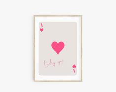 a pink playing card with hearts and the words lucky you on it, in front of a white background