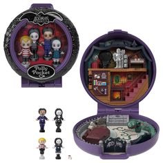 the inside of a purple box with figurines in it and an open case