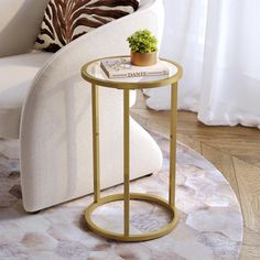 a living room with a white couch and a round table