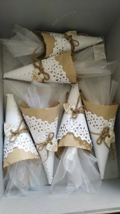 several napkins with lace and bows in a box