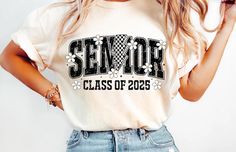 Strike a bold look with our "Senior" tee featuring a distressed black design. The dynamic lightning bolt, paired with checkered accents, daisies, and "Class of 2025," adds an edgy yet fun vibe. Crafted from soft, high-quality fabric, this tee is perfect for seniors who want to make a statement as they celebrate their final year. Cheap Graphic Tee For Graduation, 23 Class Shirts, Class Of 2025, Graduation Shirt, Graduation Shirts, Cute Graphic Tees, Lightning Bolt, Black Design, Comfort Colors