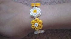 a woman's arm with yellow and white flowers on it