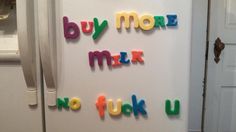 magnets that say buy more milk, no fuk u on a refrigerator door