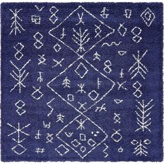 a blue rug with white designs on the front and back, in various shapes and sizes