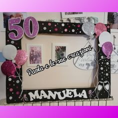 a black and white frame with pink and silver balloons on it that says manuela