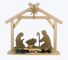 a nativity scene with two people and a baby jesus in a mangero