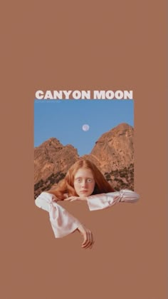 a woman with long red hair standing in front of mountains and the words canyon moon