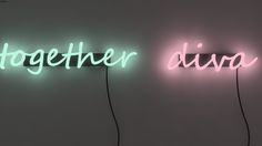 two neon signs that are on the side of a wall, one says together and the other is duo