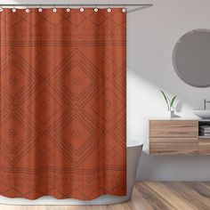 an orange shower curtain in a bathroom with wood flooring and white fixtures on the wall