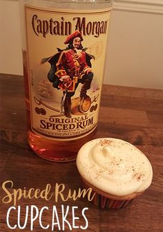 a cupcake next to a bottle of captain morgan spiced rum