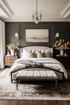 a large bed sitting in a bedroom on top of a hard wood floor next to a window