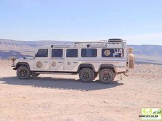 an off road vehicle parked in the desert